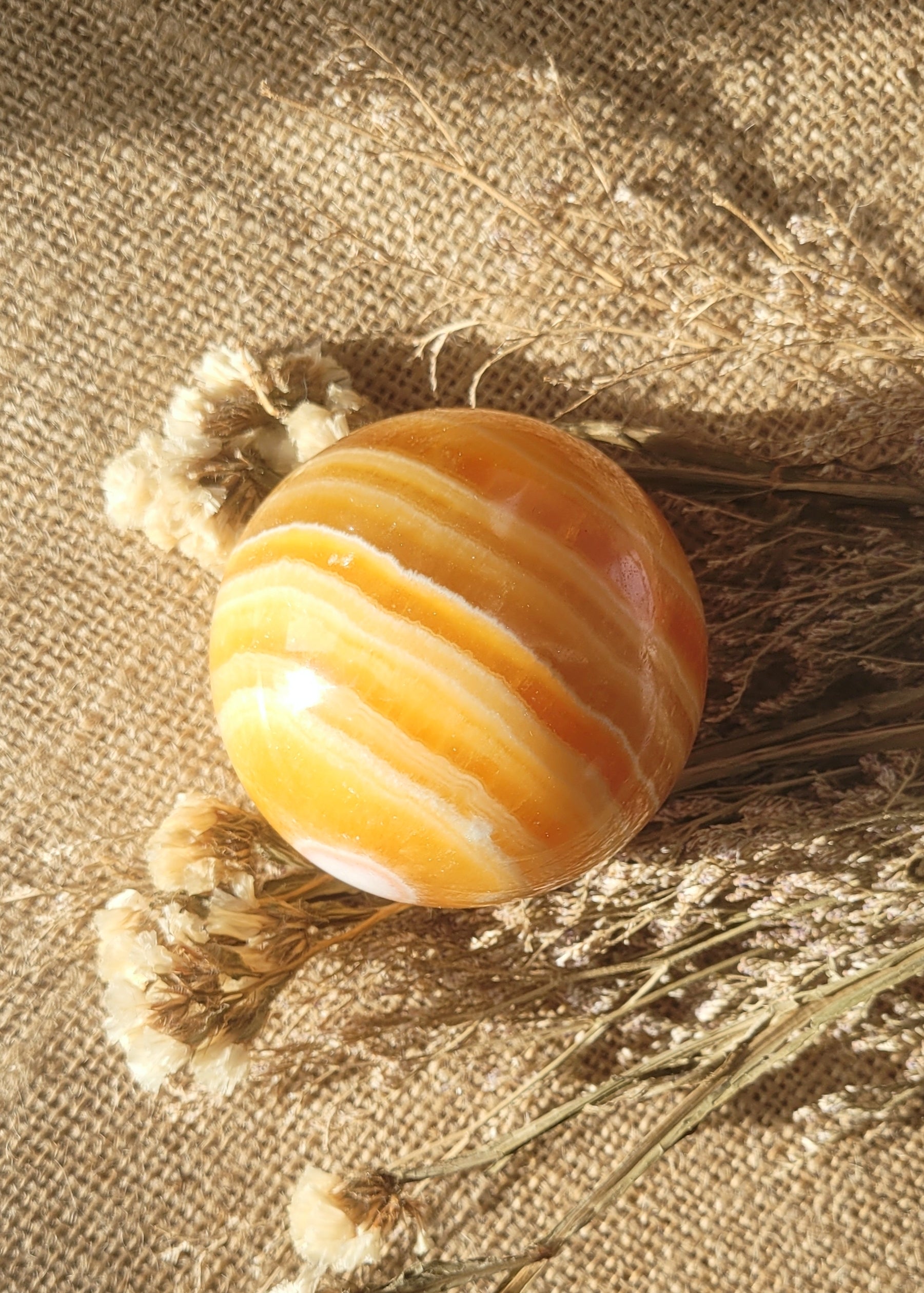 Natural orange calcite sphere // with stand