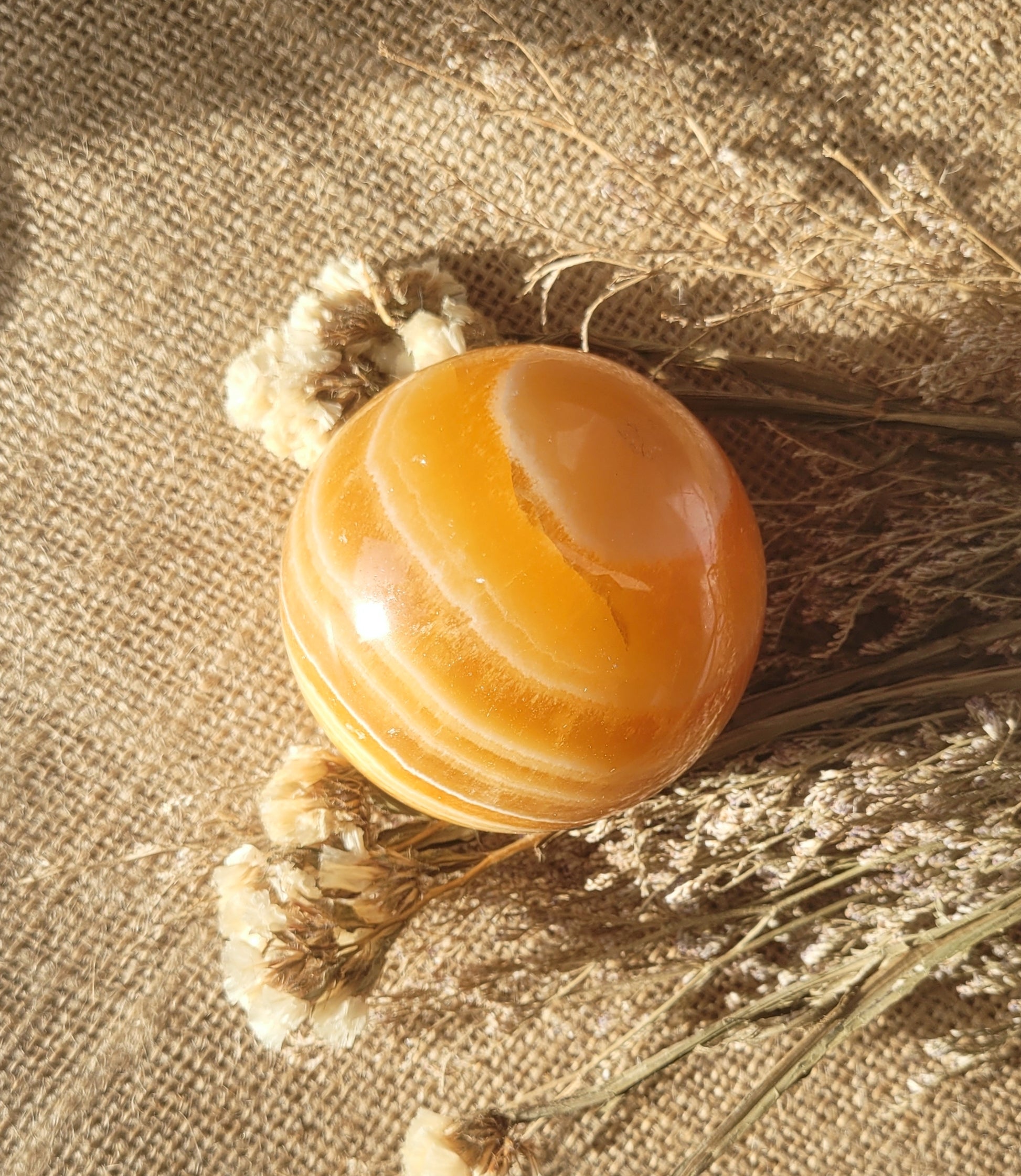 Natural orange calcite sphere // with stand